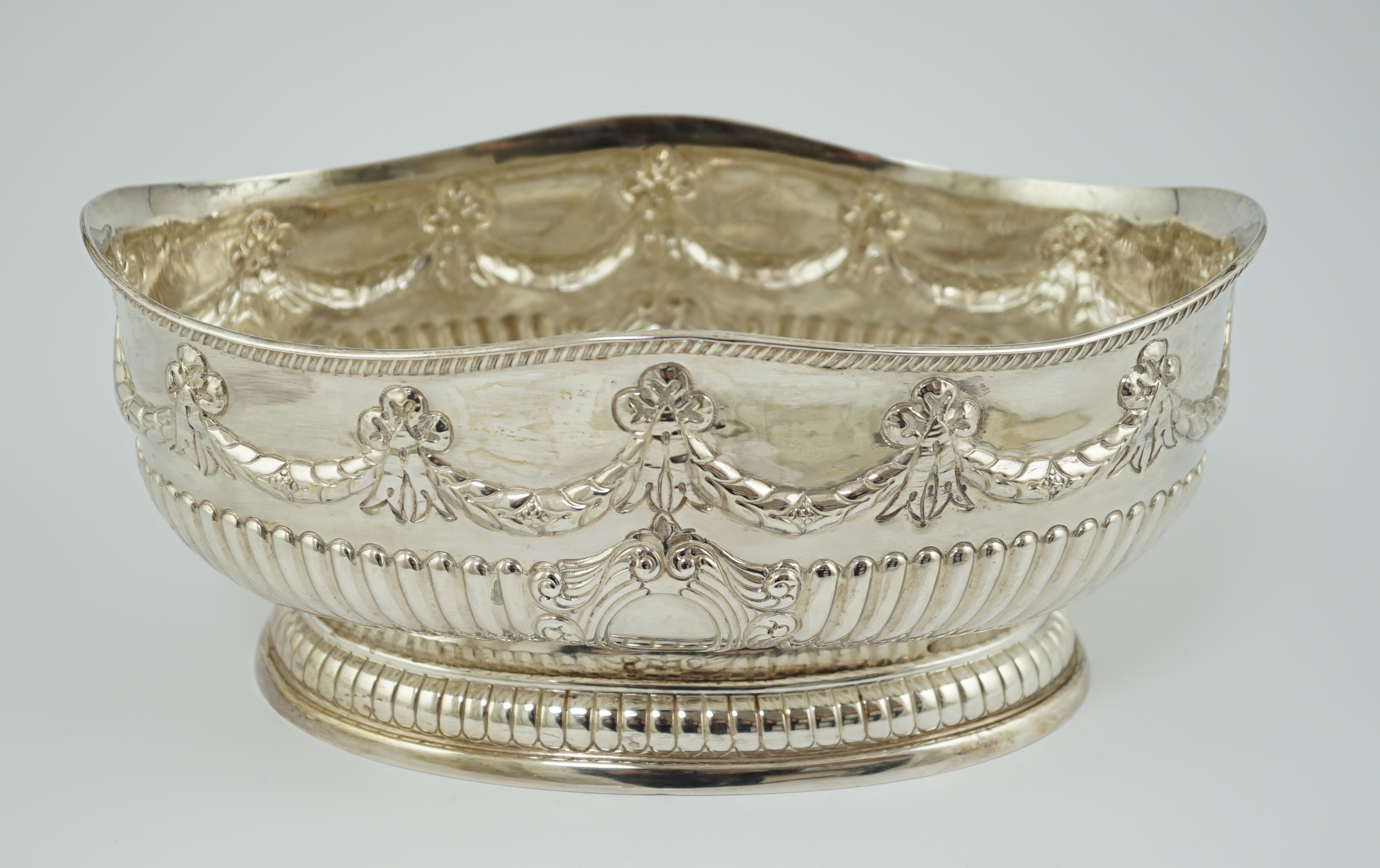 A late Victorian demi-fluted silver oval fruit bowl, by Martin, Hall & Co